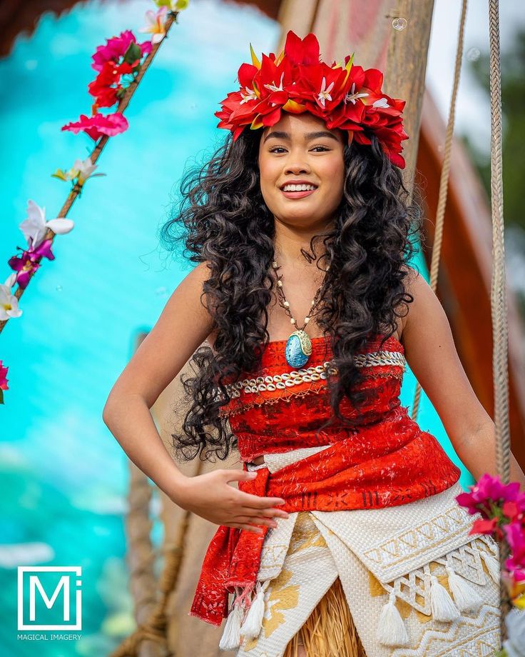 a beautiful young woman wearing a hula skirt