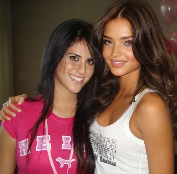 two young women standing next to each other