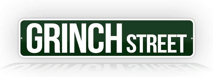 a green street sign with the word grin street in white letters on it's side