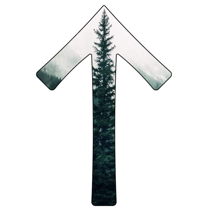 an arrow made out of glass with trees in the background and foggy sky behind it