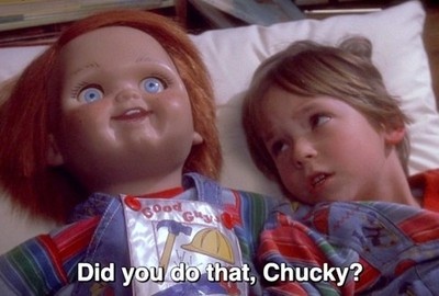 two children laying on a bed with the caption did you do that, chucky?