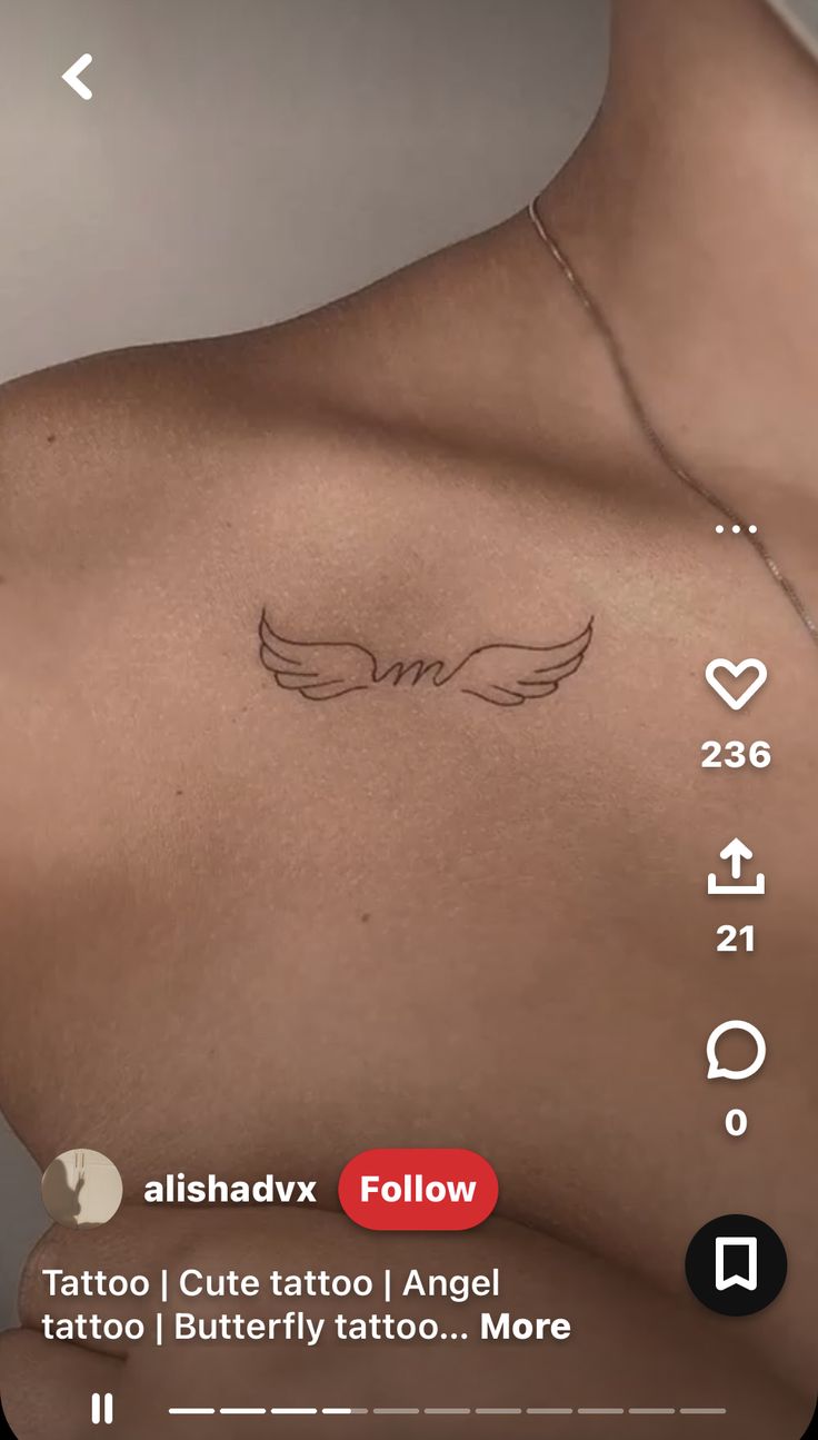 the back of a woman's chest with tattoos on her left shoulder and an angel wing