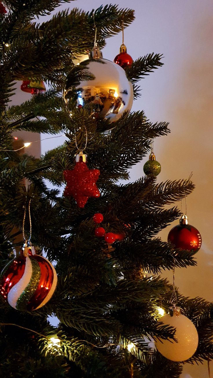 a christmas tree with ornaments hanging from it