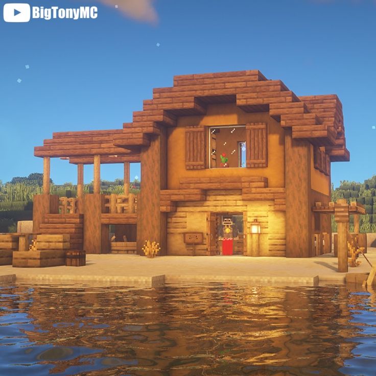 a large wooden house sitting on top of a lake