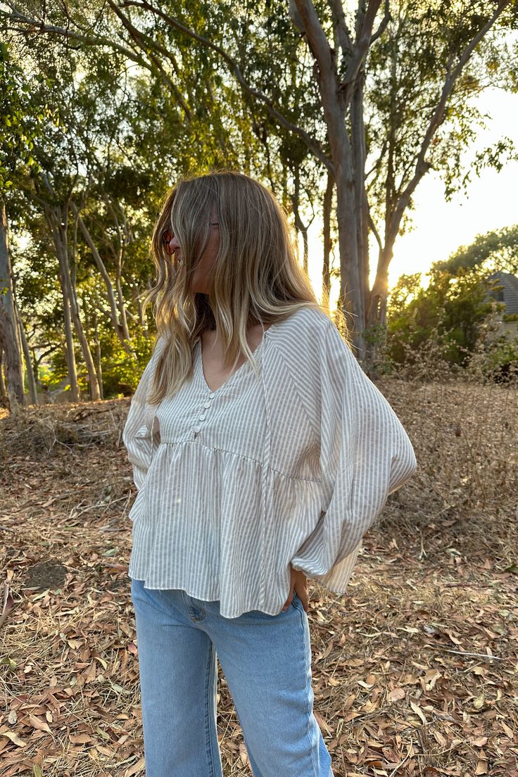 This effortless cottage core baby doll top is such a fun flowy style. We love this one styled with your fav denim, cream pant or even a trouser for a more polished look. Oversized fit. Chest: 24" Length: 24" 100% Cotton Measurements taken on a size small. Model is wearing a size small. Model is 5’9”, Size 28, Chest 34D, dress size 4. Flowy Tops Outfit, Coastal Earrings, Cream Pants, Babydoll Top, Flowy Tops, Fleetwood Mac, Earrings Collection, Polished Look, Oversized Fits