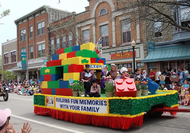 a parade float with people riding in it