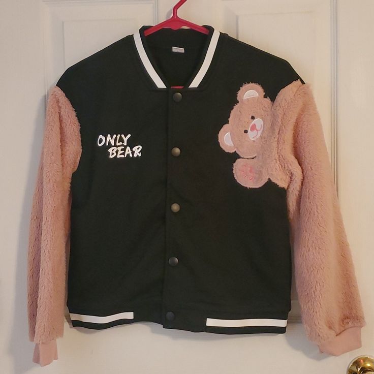 New Jacket Never Worn Bc It Was The Wrong Size. Super Cute Light Jacket With A Fuzzy Teddy Bear On The Front That Extends Across The Chest Onto Your Arm! This Is A Girls 11/12 Size. I Can Actually Fit In It Okay But Arms Are To Short Lol. I'm Small Adult. Any Questions Ask Away. Perfect Condition Came In A Bag Instead Of With Tags. Ect Hooded Winter Varsity Jacket For School, Hooded Varsity Jacket For School In Winter, Long Sleeve Winter Outerwear For School, Trendy Long Sleeve Varsity Jacket For Winter, Winter Cotton Outerwear For School, Winter School Cotton Outerwear, Pink Outerwear For School In Fall, Trendy Letter Print Outerwear For School, Trendy Fall Outerwear For School