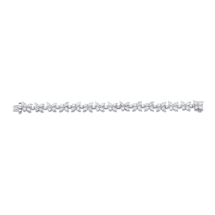 Introducing our stunning Floral Diamond Bracelet, exquisitely designed in lustrous 18k white gold. This piece features round, pear, and marquise shapes that effortlessly come together in a beautiful floral arrangement. Come Together, Floral Arrangement, Diamond Bracelet, Floral Arrangements, Pear, White Gold, Bracelet, Floral, Gold