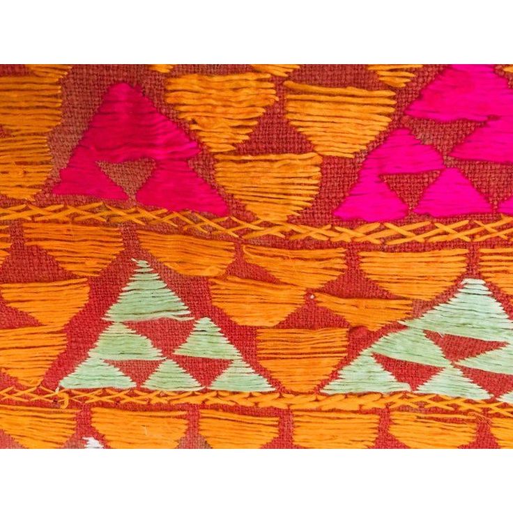 A rare pattern embroidered in silk on a hand loomed cotton background. Punjab is known for its Phulkaris. The embroidery is done with floss silk thread on coarse handwoven cotton fabric. Geometrical patterns are usually embroidered on the Phulkaris. Phulkaris and Baghs were worn by women all-over Punjab during marriage festivals and other joyous occasions. They were embroidered by the women for their own use and use of other family members and were not for sale in the market. The most favoured c Traditional Multicolor Embroidered Fabric For Puja, Traditional Multicolor Embroidered Fabric With Traditional Patterns, Bohemian Handloom Embroidered Multicolor Fabric, Bohemian Handloom Embroidered Fabric With Multicolor Embroidery, Embroidered Fabric For Puja And Festivals, Bohemian Multicolor Embroidered Handloom Fabric, Bohemian Handloom Embroidered Fabric, Traditional Handloom Wear For Festival, Traditional Embroidered Fabric With Resham For Ceremonial Use