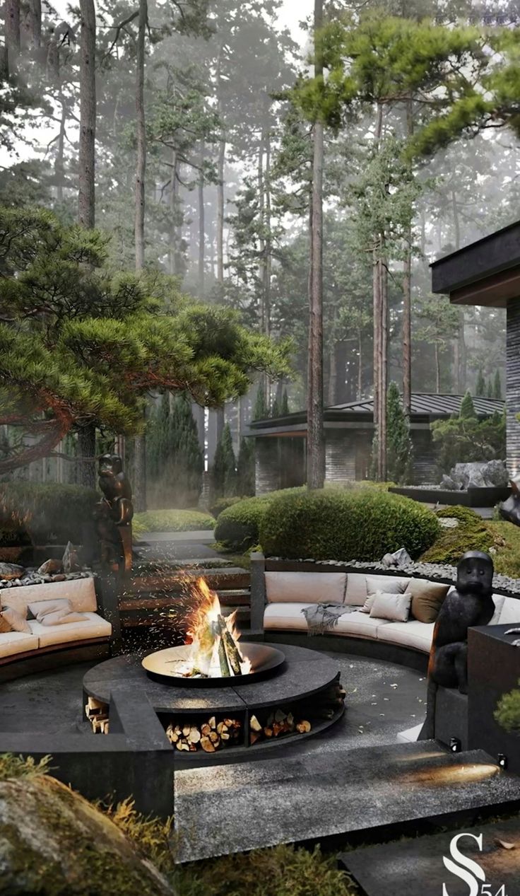 an outdoor fire pit surrounded by trees and bushes