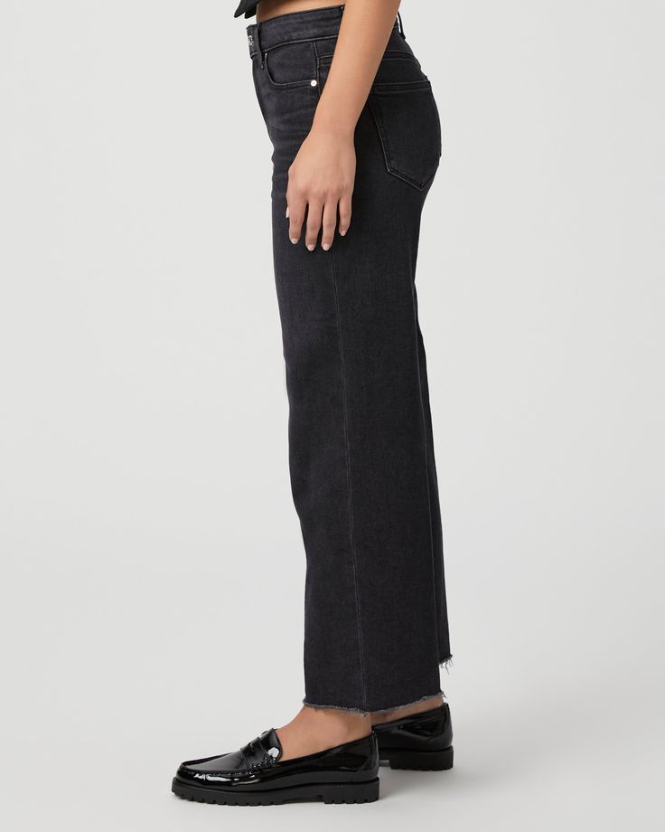 This modern high-waisted wide leg has an easy, relaxed fit and an ankle length silhouette. This style is cut from our PAIGE Vintage denim and comes in a vintage black wash with whiskering, fading, and a raw hem. PAIGE Vintage takes all of the work out of breaking in your favorite pair of vintage jeans. We've combined the comfort of stretch with everything you love about authentic vintage denim to create super soft jeans that feel perfectly lived-in from the very first wear. | Anessa Wide Leg Jea Black High-rise Cropped Jeans For Work, Black High Rise Cropped Jeans For Work, Black Wide Leg Cropped Jeans For Work, Chic Wide Leg Flare Jeans In Washed Black, Chic Wide Leg Washed Black Flare Jeans, Black Wide Leg Cropped Jeans With Five Pockets, Black Cropped Straight Hem Jeans With Five Pockets, Black Cropped Jeans With Straight Hem, Black Cropped Jeans With Five Pockets