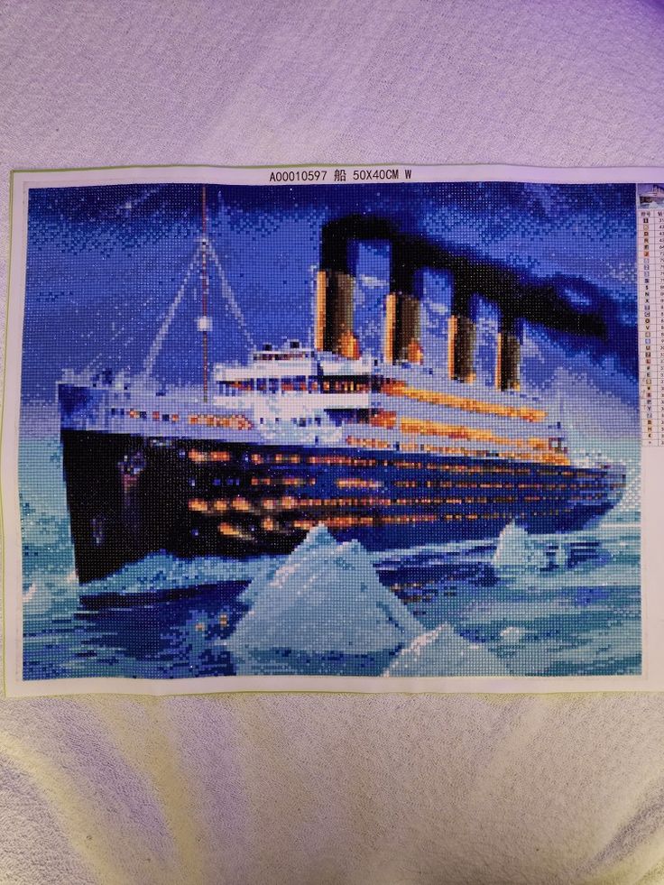 an image of a cruise ship in the ocean with icebergs on it's side