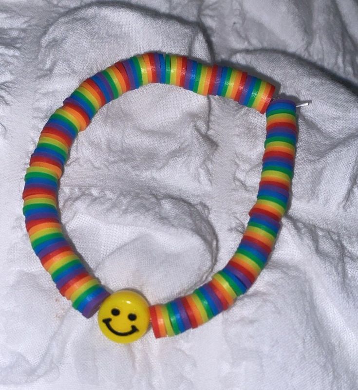 a bracelet with a smiley face on it