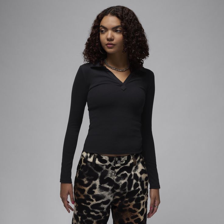 Soft, stretchy and oh-so comfortable. Made for everyday wear, this ribbed long-sleeve top gives you a confident, casual look with a body-skimming fit and V-neck design. Black Ribbed Long Sleeve Top For Spring, Fitted Black Ribbed Long Sleeve Top, Fitted Black Long Sleeve Top With Ribbed Detail, Fitted Black Long Sleeve Ribbed Top, Fitted V-neck Top With Ribbed Cuffs, Black Long Sleeve Top For Fall, Trendy Winter Tops In Elastane, Black Ribbed Long Sleeve Top For Winter, Fall Loungewear Tops In Elastane