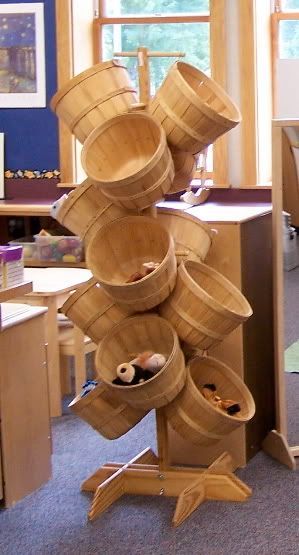 a stack of wooden buckets sitting on top of a table