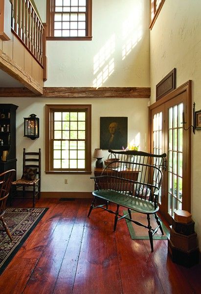 a living room filled with furniture and wooden floors