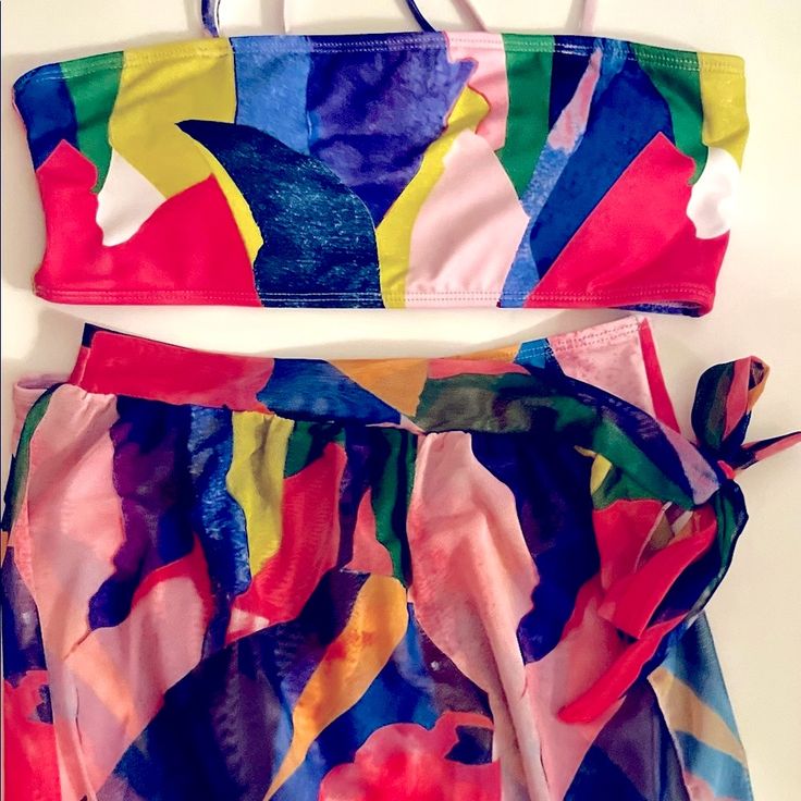 Bikini W/ Matching Sarong Nwt. Size Medium. Never Worn, Brand New. The Perfect 3-Piece Swimsuit - Bright, Vibrant Colors. High-Waist Bottoms Have Medium Coverage & Pair Perfectly With The Matching Sarong That Ties On One Side. Top Has Adjustable Straps To Help You Adjust To The Perfect Fit. This 3-Piece Swim Set Is An Absolute Must Have! Check Out My Other Listings To Bundle & Save!! Offers Welcome! #Swim #Swimsuit #3pieceswimset #Swimset #Swimbottoms #Cheeky #Coverage #Coverup #Sarong #Summer #Swimsuit #Womensswim #Threepieceswim #Affordablefinds #Fashionfinds #Fashionswim Multicolor Printed Sarong For Pool, Beach Season Vibrant Print Sarong, Multicolor Two-piece Beach Set, Beachy Multicolor Tie-side Sarong, Colorblock Swimsuit, Multicolor Printed Sarong For Beach Cover-up, Swim Sets, Swimsuit Set, Black One Piece