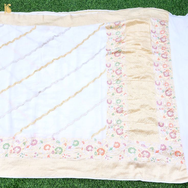 An exclusive saree from Khinkhwab. Add a dash of your favorite color to your ethnic look with this beautiful Banarasi saree from our dyeable georgette collection. The Saree is made of pure Georgette. Contact us for color and customization. White Georgette Saree With Printed Border, Traditional White Chanderi Pre-draped Saree, White Silk Saree With Traditional Drape, White Silk Pre-draped Saree With Traditional Drape, White Silk Pre-draped Saree In Traditional Style, White Silk Pre-draped Saree, Unstitched White Blouse Piece In Traditional Drape, Semi-stitched White Saree For Navratri, White Semi-stitched Saree For Navratri