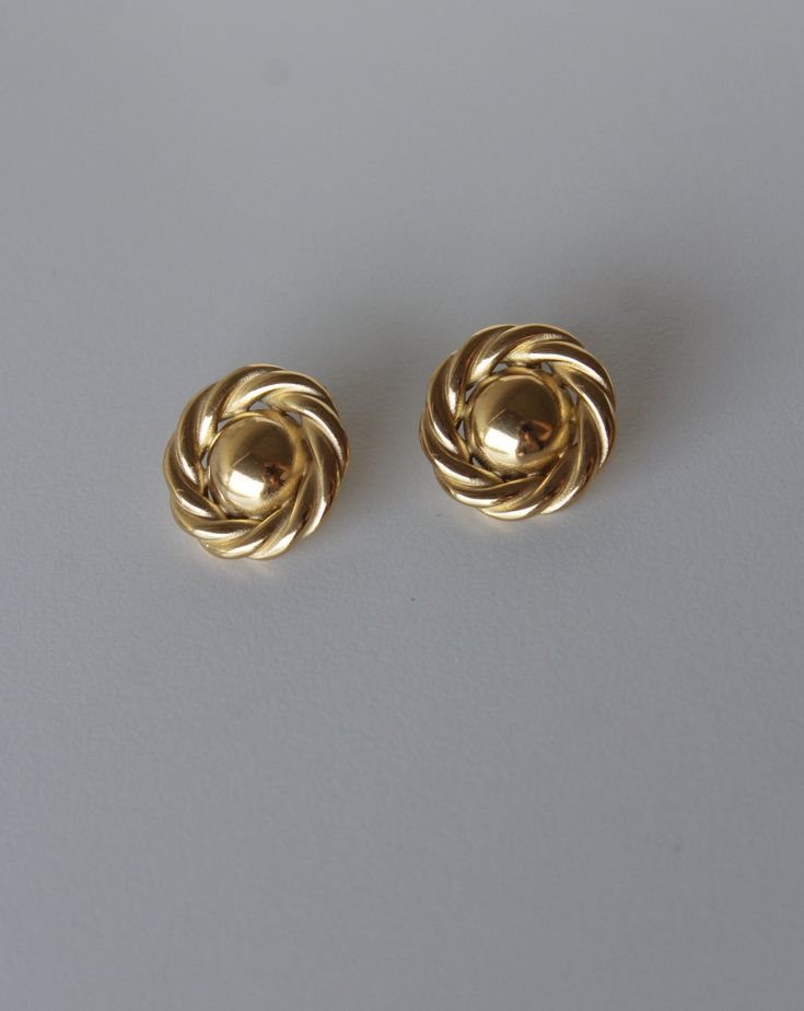 Made from high-quality stainless steel, these earrings boast durability and a lustrous shine that stands the test of time. Their vintage-inspired design adds a touch of old-world charm to any ensemble, making them a versatile accessory for both casual and formal occasions. Gold Classic Clip-on Plug Earrings, Elegant Tarnish Resistant Metal Clip-on Earrings, Classic Metal Jewelry With Polished Finish, Timeless Polished Earrings For Formal Occasions, Elegant Metal Clip-on Earrings For Anniversary, Everyday Vintage Tarnish Resistant Earrings, Classic Round 14k Gold Clip-on Earrings, Classic Earrings With Polished Finish, Classic Polished Earrings For Anniversary