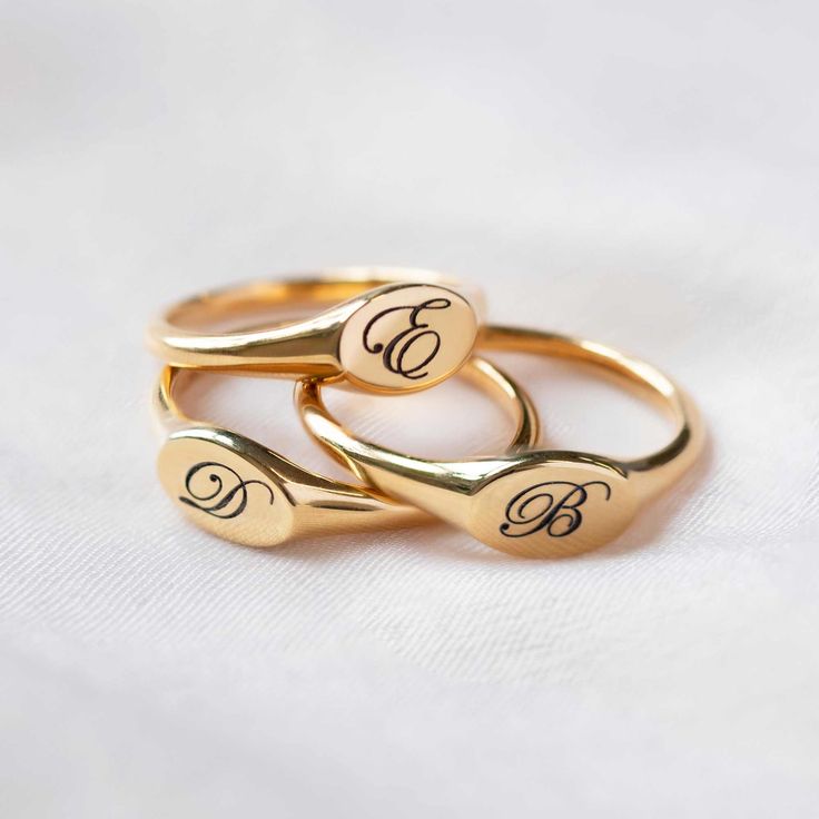 Our stunning oval signet ring is the perfect addition to any jewelry collection, with an unqiue engraving that brings a personal touch to this timeless piece. Thick layer of 14K Gold over Sterling Silver Hypoallergenic, lead and nickel free Made in NYC Side Oval width 8mm x Height 5mm Band Thickness 2mm #R009-G Timeless Oval Cabochon Signet Ring As Gift, Gold Oval Signet Ring With Engraving Option, Classic Gold Engraved Oval Ring, Gold Oval Engraved Signet Ring, Classic Oval Signet Ring Personalized, Timeless Oval Initial Ring With Engraving, Timeless Personalized Gold Signet Ring, Timeless Oval Engraved Initial Ring, Classic Personalized Oval Signet Ring