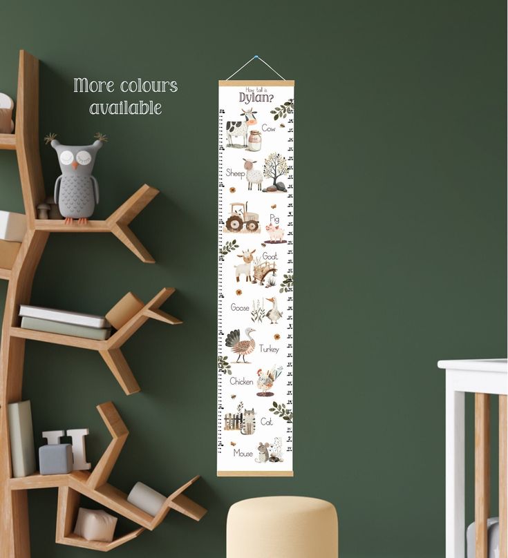 a growth chart with animals on it next to a crib and bookshelf