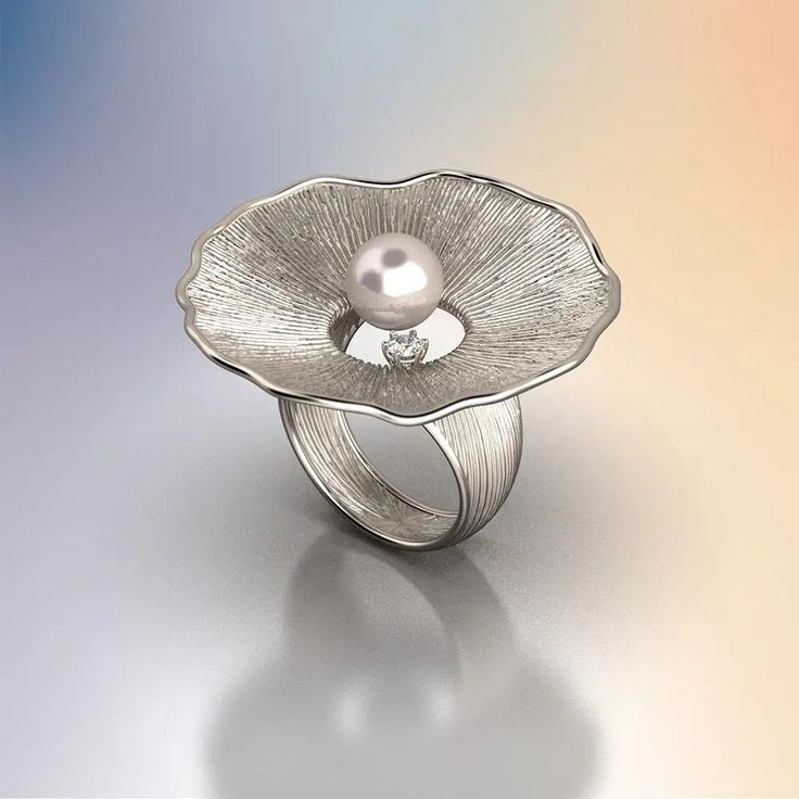 Discover the allure of our Pearl and Diamond Ring, a masterpiece of Italian craftsmanship. This exquisite ring features an 8mm Akoya White Pearl set in your choice of 14k or 18k solid gold—available in yellow, white, or rose gold. Complemented by a 0.1 Ct natural diamond, this ring is a perfect blend of sophistication and timeless beauty. Handcrafted in Vicenza, Italy, this ring embodies the finest traditions of Italian jewelry making. Its organic design, inspired by nature, adds a unique touch Elegant Brilliant Cut Flower Promise Ring, Elegant Sterling Silver Diamond Ring, Elegant Sterling Silver Flower Ring With Brilliant Cut, Elegant Silver Flower Ring With Diamonds, Elegant Diamond Solitaire Flower Ring, Elegant Pearl Ring With Center Stone For Promise, Elegant Pearl Promise Ring With Center Stone, Elegant Solitaire Diamond Flower Ring, Elegant Diamond Flower Ring For Anniversary