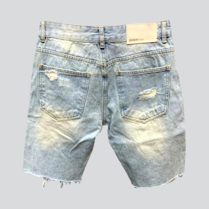 Make a bold statement with our 2023 Summer Collection Raw Hem Distressed Denim Shorts the epitome of punkish trend and fashion! Perfect for casual outings. these medium-rise shorts feature a zipper and button closure for a sleek fit.Why These Shorts Should Be Your Next PurchaseThese shorts are patterned to make you look and feel fantastic. Crafted from premium quality denim. they are durable yet comfortable. and the raw hem distressed detailing gives them a unique and city look. The slim fit ens Spring Streetwear Grunge Jean Shorts, Grunge Jean Shorts For Spring Streetwear, Spring Grunge Jean Shorts For Streetwear, Trendy Light Wash Jean Shorts For Streetwear, Spring Streetwear Jean Shorts, Edgy Streetwear Jean Shorts For Summer, Edgy Jean Shorts For Summer Streetwear, Light Wash Jean Shorts For Streetwear, Ripped Bottoms For Streetwear In Summer