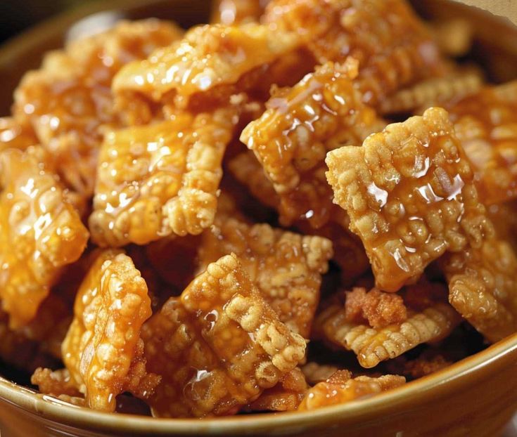 a close up of a bowl of food that is filled with caramel flakes