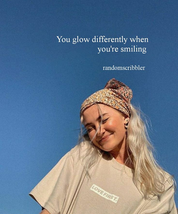 a woman is smiling and holding a cell phone with a quote above her head that says happiness takes up a different face, everyday