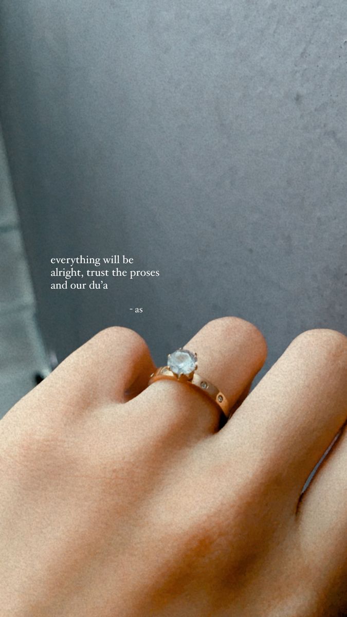 a woman's hand with a ring on it and a quote written in the middle