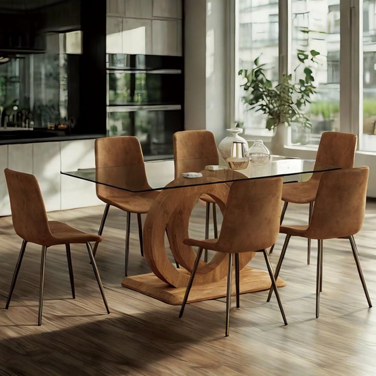 a glass dining table surrounded by brown chairs in a room with wooden floors and large windows