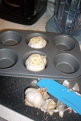 an uncooked muffin tin with some food in it