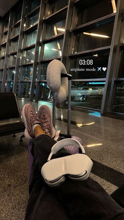 a person with their feet up in the air at an airport