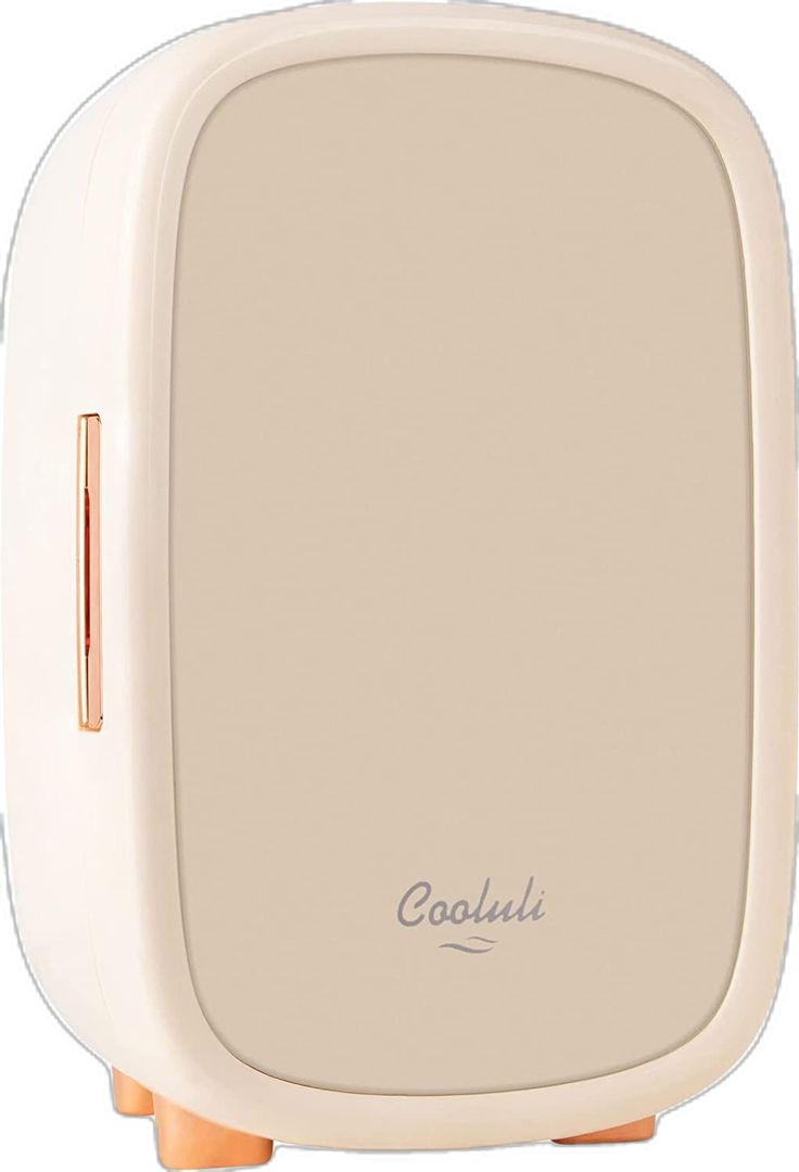 the back side of a white and gold colored speaker with an orange cord attached to it