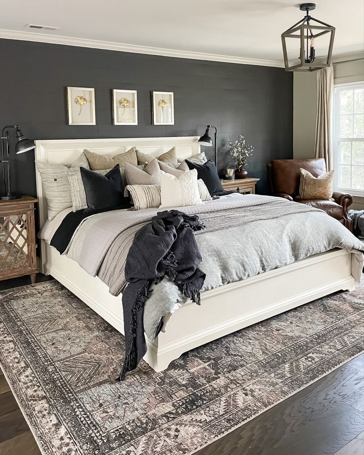 a large bed sitting on top of a wooden floor