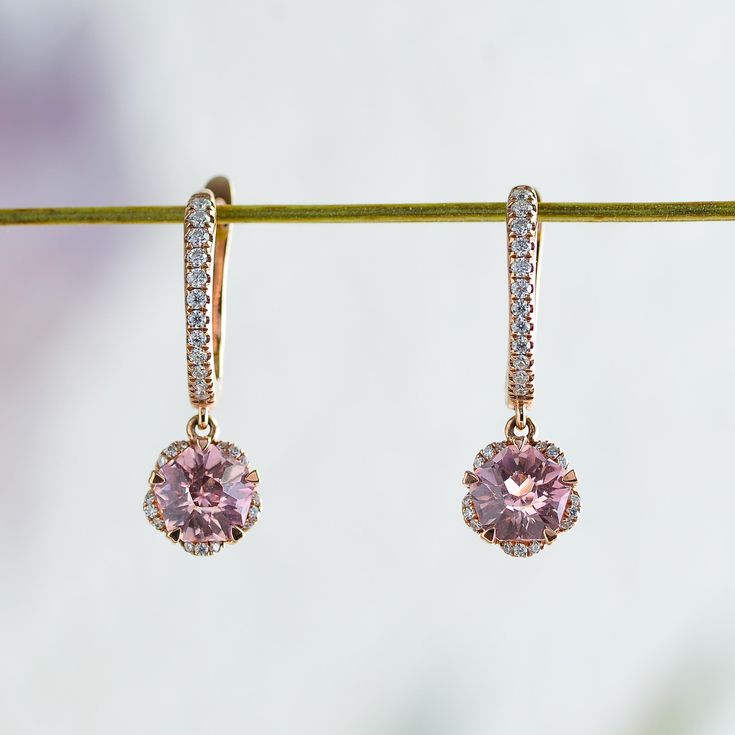 Whimsical yet elegant, Hanaka features a pair of blush-pink Rosé sapphires cut in the shape of an open blossom and framed by petals of glistening moissanites. In the drop style, the blooms dangle delicately from studded huggie hoops, adding a touch of elegance to the delightful spirit of spring. Made to order. Please allow 6-8 weeks for delivery. DETAILS: Gemstone: Type: Sapphire (cultured) Size: 6 mm (each) Color: Rosé Pink Cut: Blossom Design: Style: Drop Accents: Round Brilliant Moissanites B Rosé Pink, Blossom Design, 8 Weeks, Design Style, Round Brilliant, Pink Rose, Pink Roses, Belly Button Rings, Blush Pink