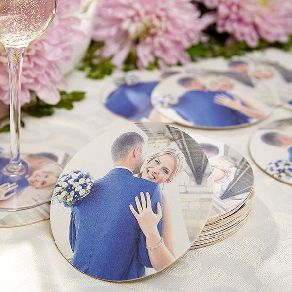 a table topped with lots of plates covered in pictures and wine glasses on top of it