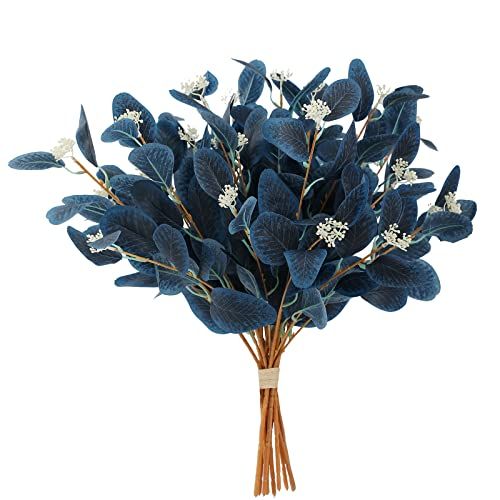 a bouquet of blue leaves and white flowers