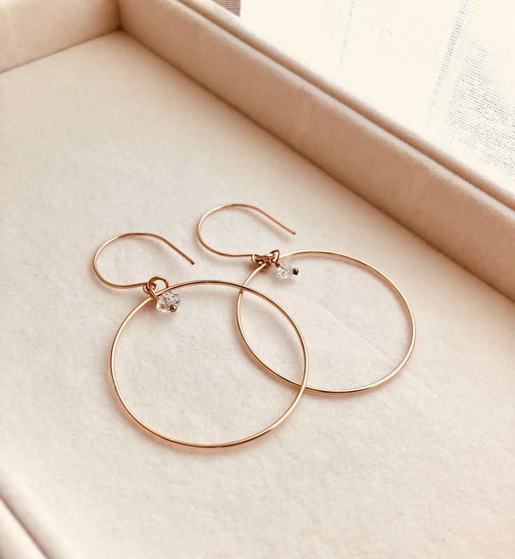 Just as effortless as they are simple, these hoop earrings are an essential everyday piece. Item Details: • This listing is for A PAIR ( 2 pieces ) earrings.• All metal is components are sterling silver and 14k gold-fill• Hoops measure 40mm in diameter.• Herkimer quartz crystals prized, each Herkimer diamond is a natural entity and no stone is identical.• The order will arrive in a gift-wrapped box and free polishing cloth. It will be ready for gift giving. All our work is custom-made by hand in Everyday Hoop Jewelry In Recycled Gold, Everyday Recycled Gold Hoop Jewelry, Nickel-free Small Hoop Earrings In 14k Gold Filled, Everyday Round Huggie Earrings In Recycled Gold, Gift Tarnish Resistant Recycled Gold Hoop Earrings, Gift Recycled Gold Tarnish Resistant Hoop Earrings, Gift Recycled Gold Tarnish-resistant Hoop Earrings, Minimalist Everyday Hoop Jewelry, Dainty Hoop Jewelry For Everyday