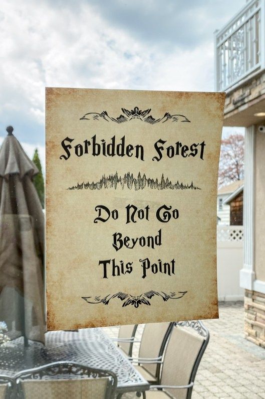 there is a sign that says forbidden forest do not go beyond this point on the table