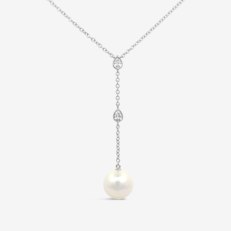 A statement piece for any stylish bride to be, this Pearl and Diamond Lariat Necklace is the perfect addition for your special day. The necklace features a two-inch gorgeous drop Pearl lariat adorned with two delicate bezel set pear shaped Diamonds. Wear with our matching earrings. White Fresh Water Pearl: 7 mm Natural Diamonds: 0.25ctw 14K White or Yellow Gold Drop: 2 Inches Length: 18 Inches Mavilo Exclusive Diamond Lariat Necklace, Pearl Lariat, Stylish Bride, Fresh Water Pearl, Earrings White, Pear Shaped Diamond, Pearl Diamond, Lariat Necklace, Bride To Be