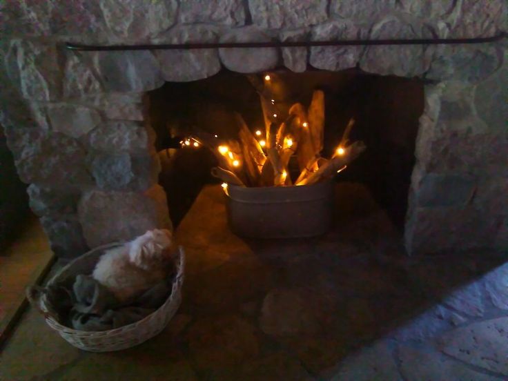 a fire place with some lights in it