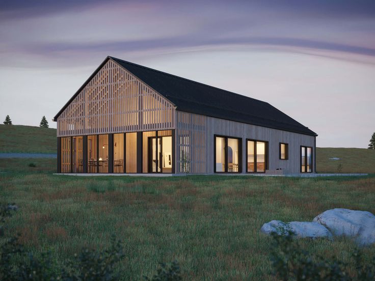 a small wooden building sitting on top of a lush green field