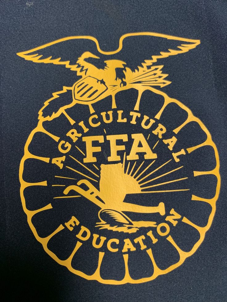 an eagle emblem on the back of a t - shirt that says agricultural f a education