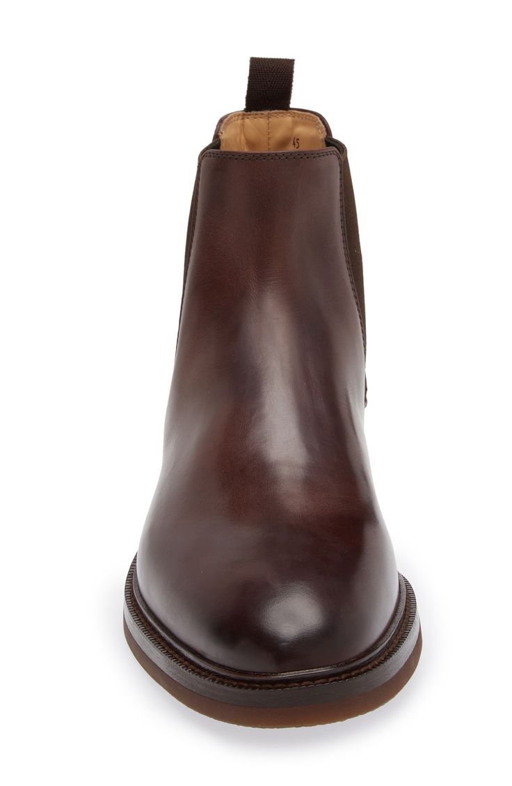 The label's impeccable Italian craftsmanship shines in the rich leather and streamlined silhouette of a timeless Chelsea boot grounded with a flexible sole. Pull-on style with elastic gore insets Leather and textile upper and lining/synthetic sole Made in Italy Designer Shoes Classic Leather Boots With Rubber Sole, Slip-on Calf Leather Boots With Rubber Heel Cap, Leather Chelsea Boots With Goodyear Welted Almond Toe, Goodyear Welted Leather Chelsea Boots With Almond Toe, Luxury Leather Chelsea Boots With Suede Lining, Fitted Leather Chelsea Boots With Almond Toe, Classic Leather Boots With Leather Sole, Leather Chelsea Boots With Goodyear Welt, Classic Chelsea Boots With Suede Lining And Round Toe