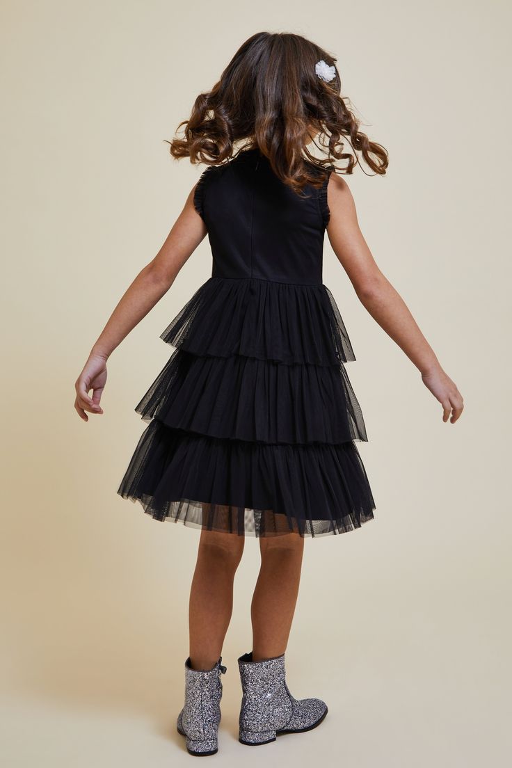 A dress designed for twirling and dancing, Evie features sequin detailing and a tutu inspired tulle skirt. Realised in classic black, pair Evie with sparkling shoes and accessories for the perfect party outfit. Embellished Black Dress, Sparkling Shoes, Tiered Tulle Skirt, Amelia Rose, Sparkle Shoes, Black Sequin Dress, Perfect Party, Girls Dress, Black Sequins