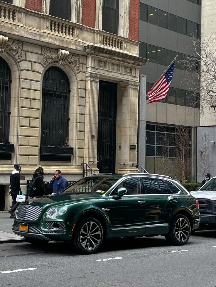 two cars are parked on the side of the street