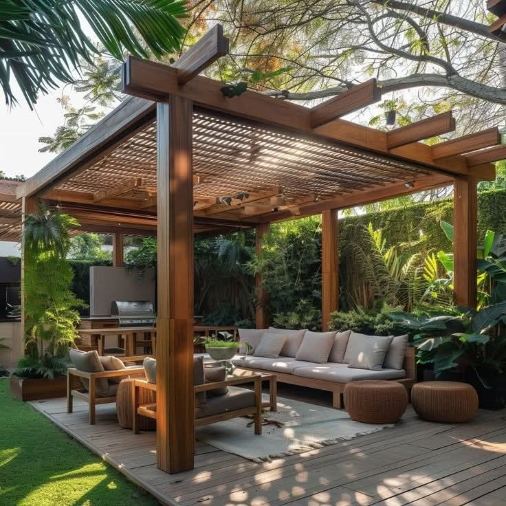 an outdoor living area with couches, tables and chairs under a pergolated roof