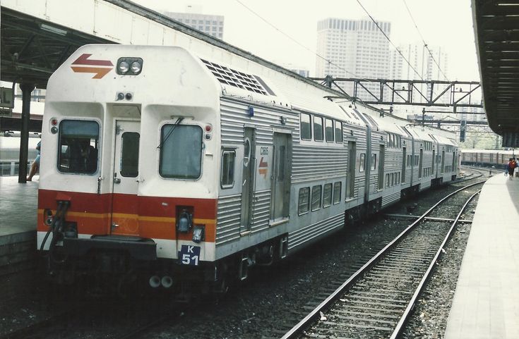 the train is stopped at the station waiting for passengers to get on or off it