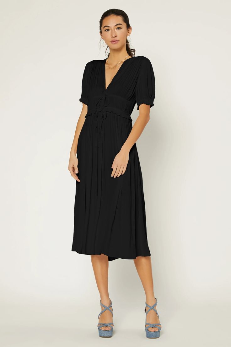 This V-neck dress hugs the figure with pleating at the bodice before flowing to a shin-skimming hem. Slender ties draw in the midsection, delivering an elegant finish.  On average, customers say it fits large •V-neck •Short sleeves with elastic  •Pleated bodice •Adjustable ties DIMENSIONS •Standard: 51" L Item number 2 Solid V-neck Dress With Tie Waist, Solid Color V-neck Dress For Daywear, Elegant Viscose Midi Dress With Surplice Neckline, Pleated V-neck Dress With Fitted Waist, Flattering V-neck Midi Dress, Fitted Rayon Midi Dress With Short Sleeves, V-neck Midi Dress With Pleated Waist For Formal Occasion, V-neck Midi Dress With Pleated Waist For Formal Events, Chic Midi Dress With Gathered Short Sleeves